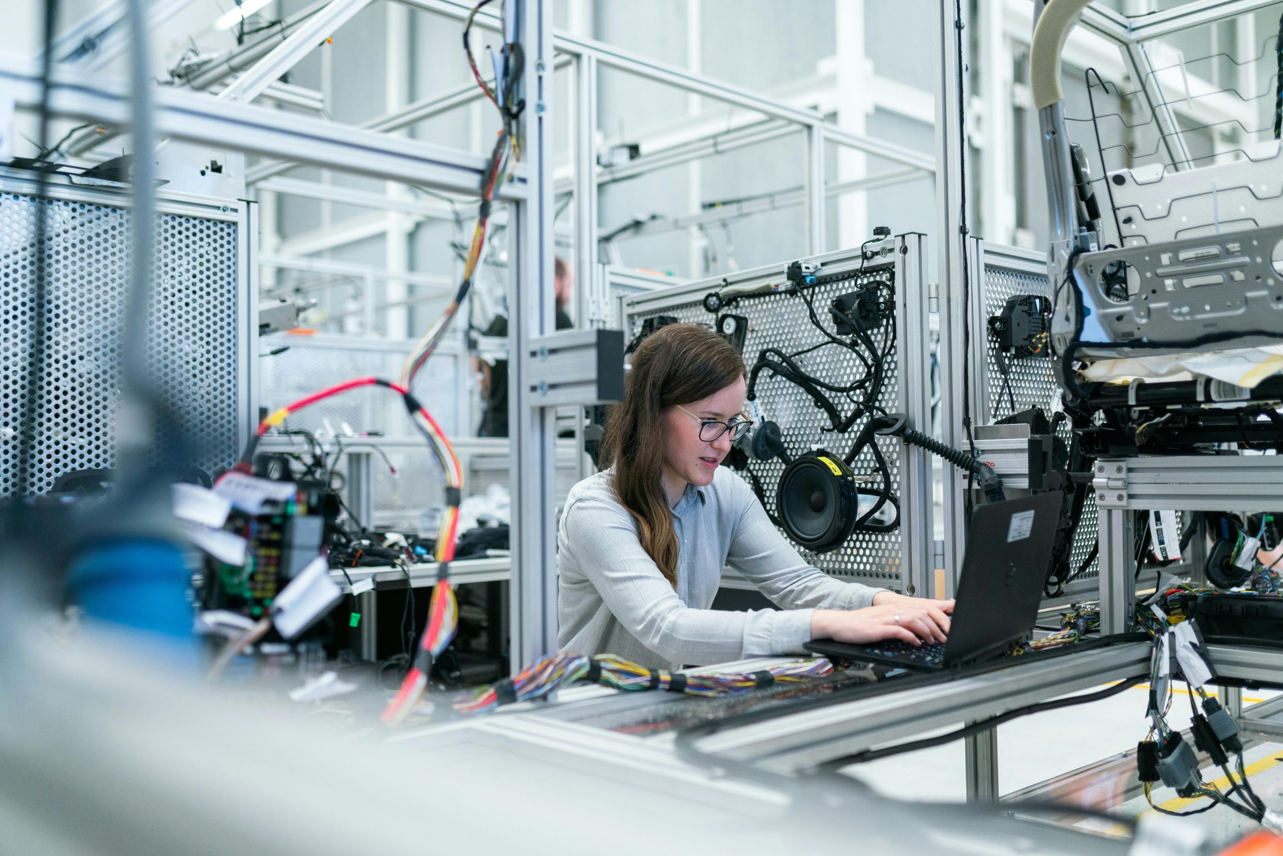 Engineer working on advanced electronic systems inside a high-tech laboratory environment.