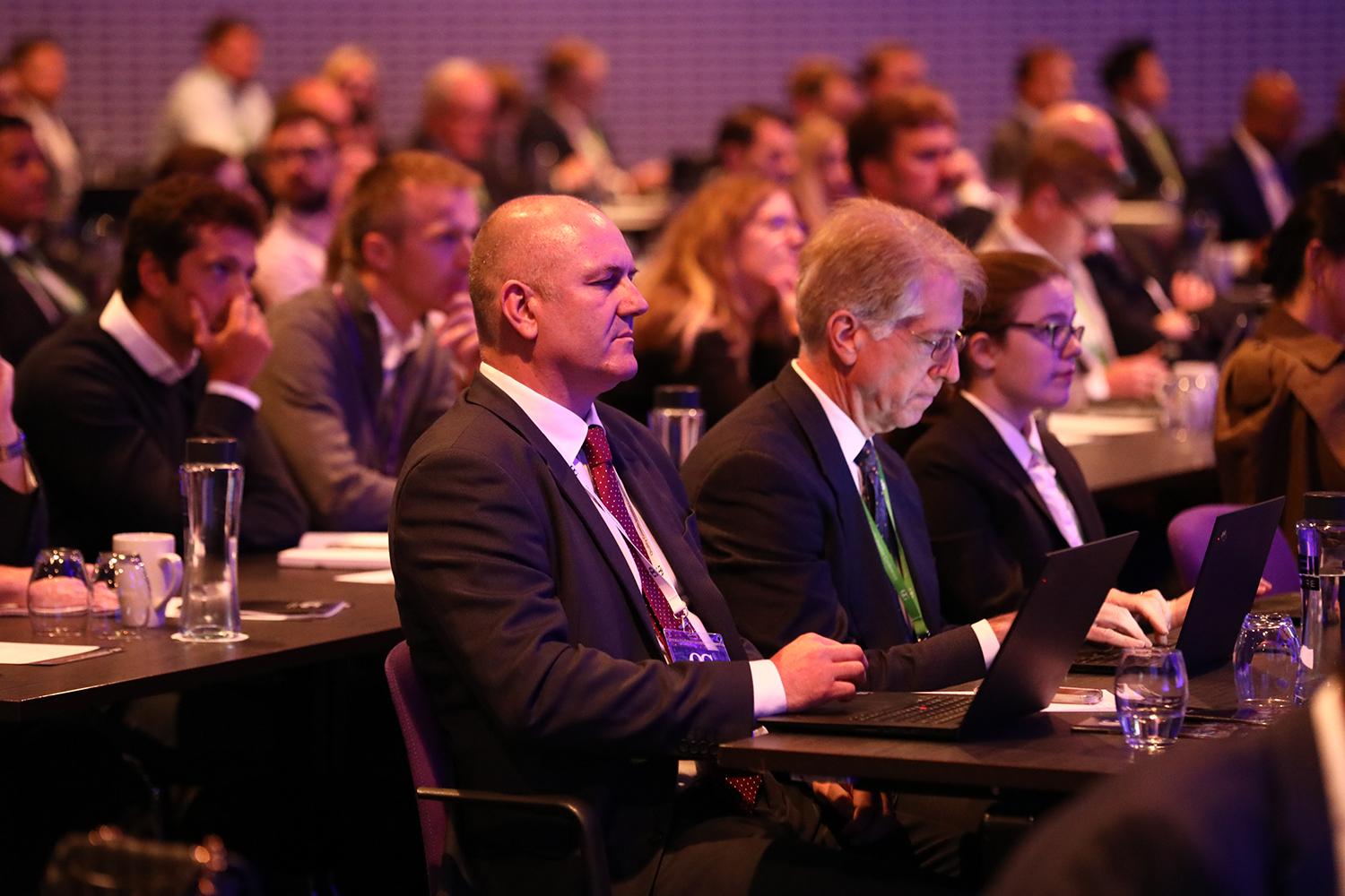 Business executives and professionals attending a conference, representing Nukkleus’ expansion into the defense sector and strategic acquisition of Star 26.