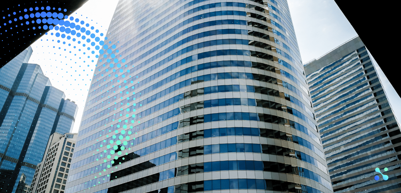 Curved glass skyscraper reflecting the sky, symbolizing corporate growth and financial consolidation.